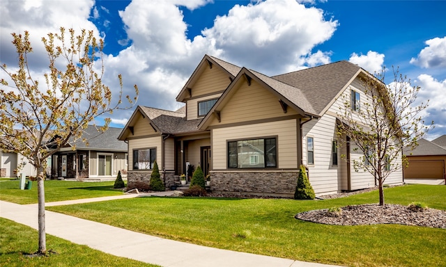 craftsman inspired home with a front yard and a garage