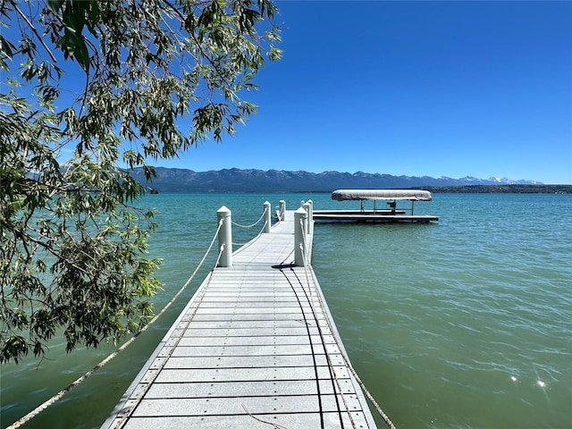 dock area with a water and mountain view