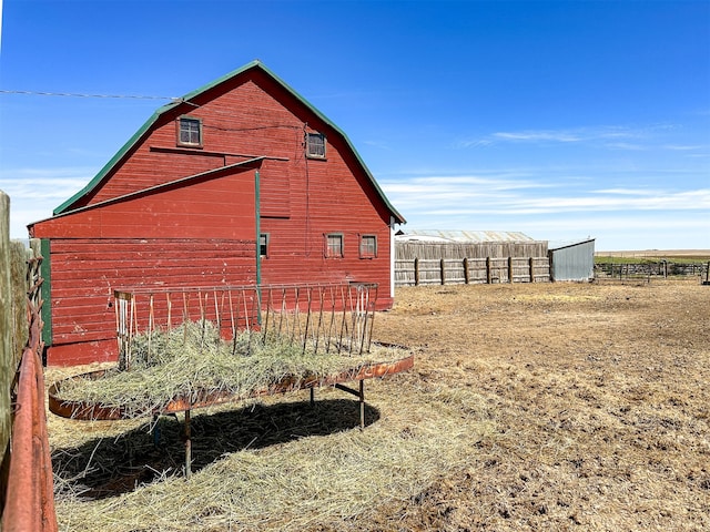 view of side of property with an outdoor structure