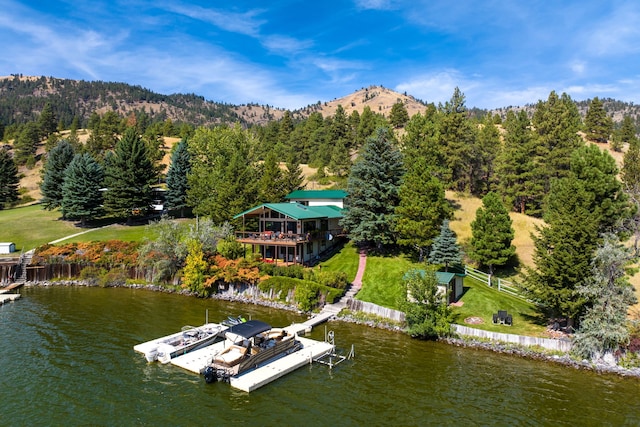 bird's eye view with a water and mountain view