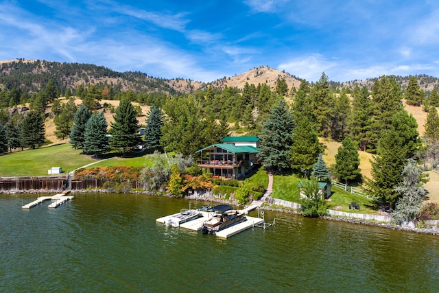 aerial view featuring a water and mountain view