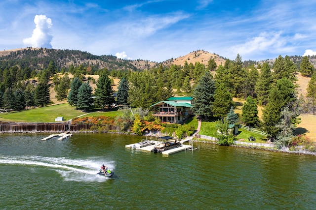 drone / aerial view with a water and mountain view