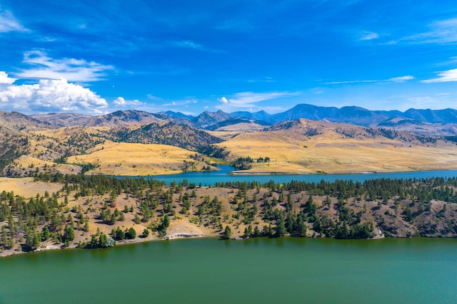 bird's eye view with a water and mountain view