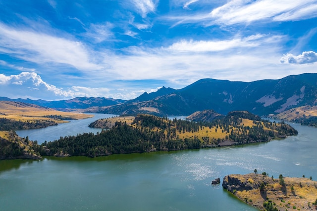 exterior space with a water and mountain view