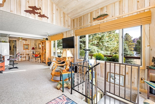 interior space with lofted ceiling and ceiling fan