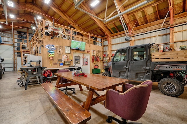 garage featuring a workshop area and a garage door opener