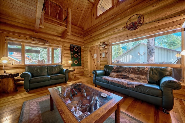 living area featuring high vaulted ceiling, wooden ceiling, hardwood / wood-style floors, and rustic walls