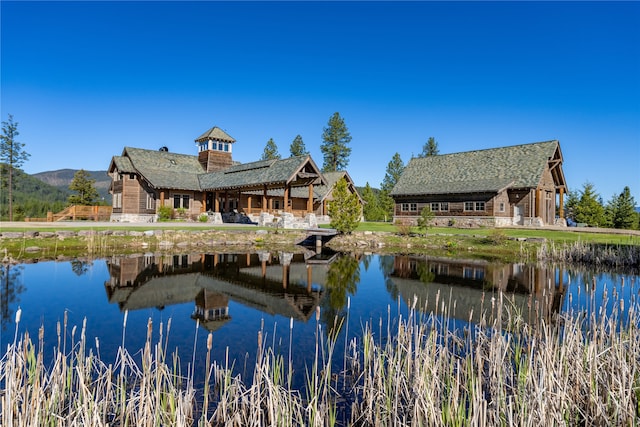 back of house featuring a water view