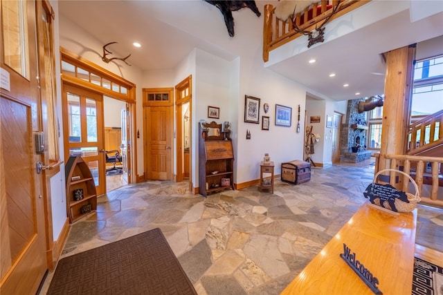 entryway featuring recessed lighting, french doors, baseboards, and stone tile floors