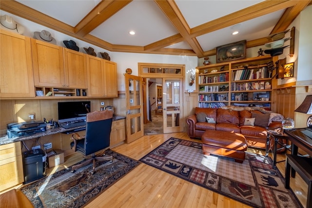 office space with coffered ceiling, french doors, light wood finished floors, beamed ceiling, and built in desk