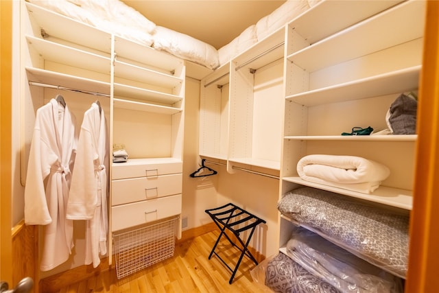 spacious closet featuring wood finished floors