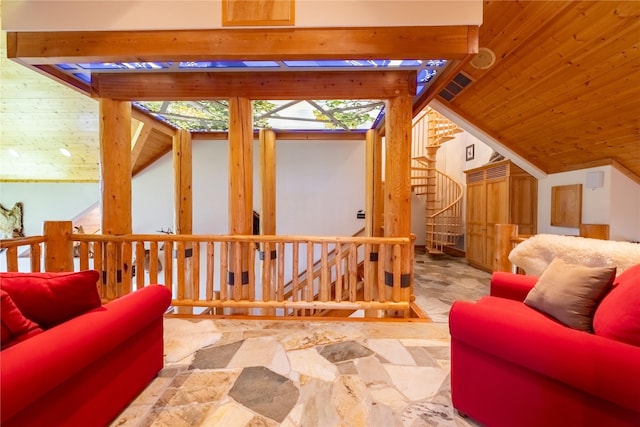 bonus room with lofted ceiling, stone flooring, and stairway