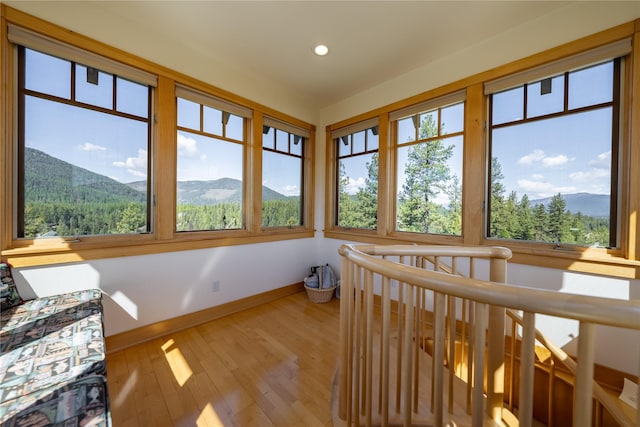 sunroom / solarium featuring a mountain view