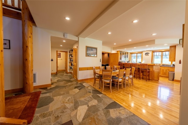 dining space featuring baseboards, visible vents, light wood-style flooring, and recessed lighting