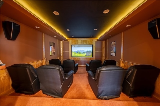 cinema featuring carpet flooring, a raised ceiling, and recessed lighting