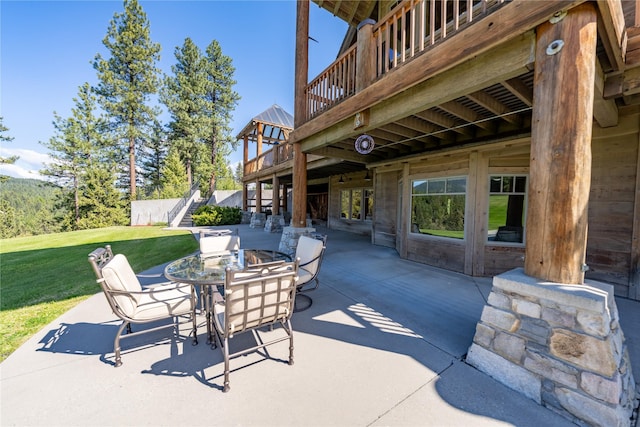 view of patio featuring stairway and outdoor dining area