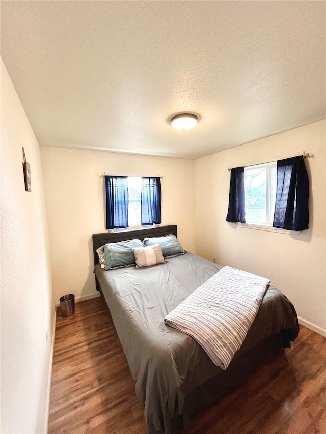 bedroom featuring hardwood / wood-style flooring