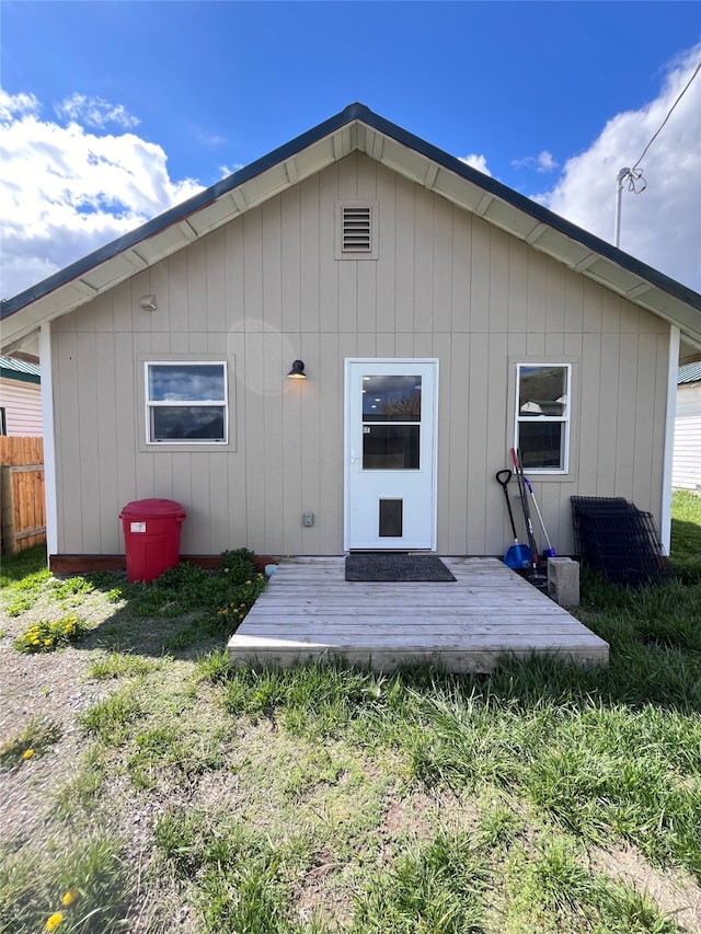 back of house featuring a deck