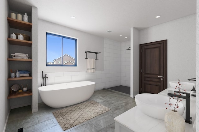 209 Mannington St, Kalispell, MT 59901 - full bath with double vanity, a freestanding tub, a tile shower, and recessed lighting