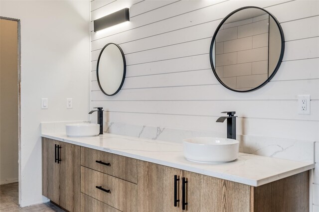 209 Mannington St, Kalispell, MT 59901 - full bathroom with double vanity and wooden walls