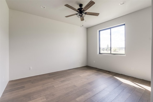 209 Mannington St, Kalispell, MT 59901 - unfurnished room with wood finished floors, a ceiling fan, and recessed lighting