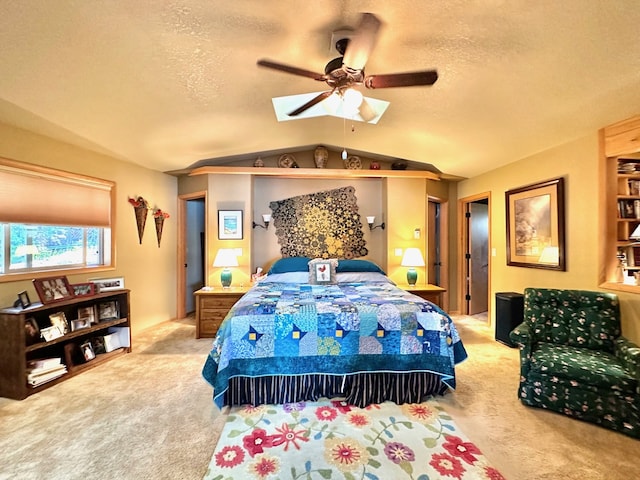 bedroom featuring ceiling fan, light colored carpet, a textured ceiling, and vaulted ceiling