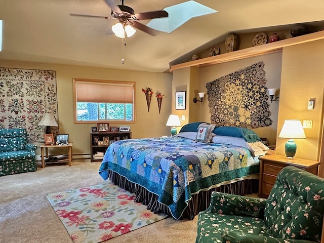 carpeted bedroom with a skylight and ceiling fan