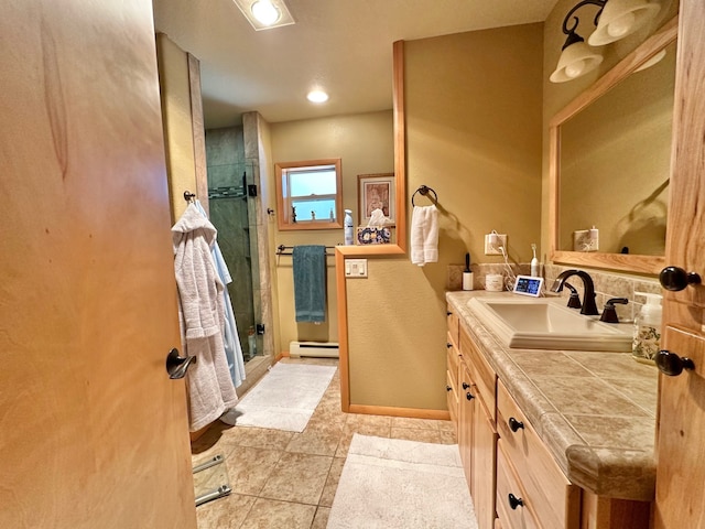 bathroom with vanity, tile patterned floors, walk in shower, and a baseboard heating unit