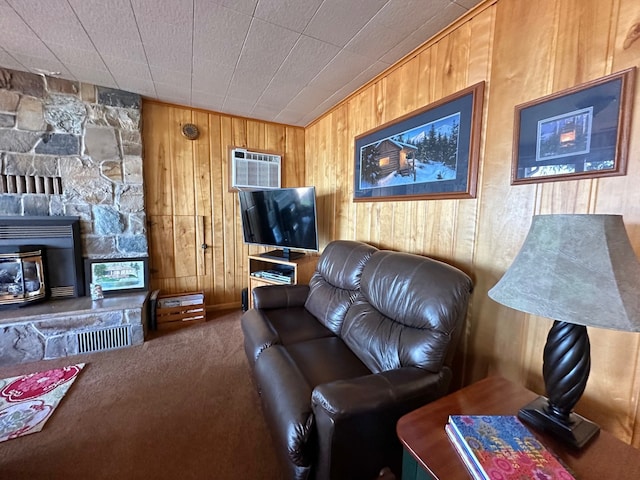 carpeted living room featuring wood walls and a wall mounted AC