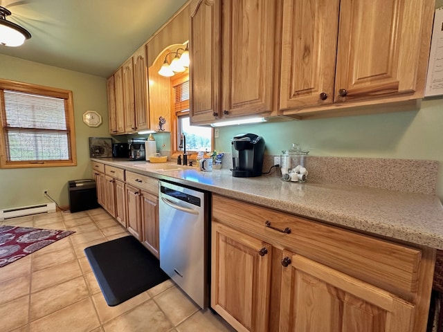 kitchen with dishwasher, light tile patterned floors, sink, and a baseboard radiator