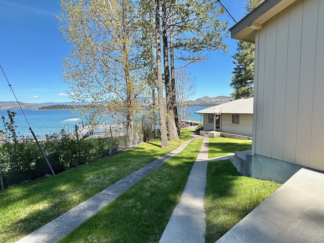 view of yard with a water and mountain view