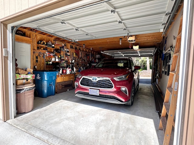 garage featuring a workshop area and a garage door opener