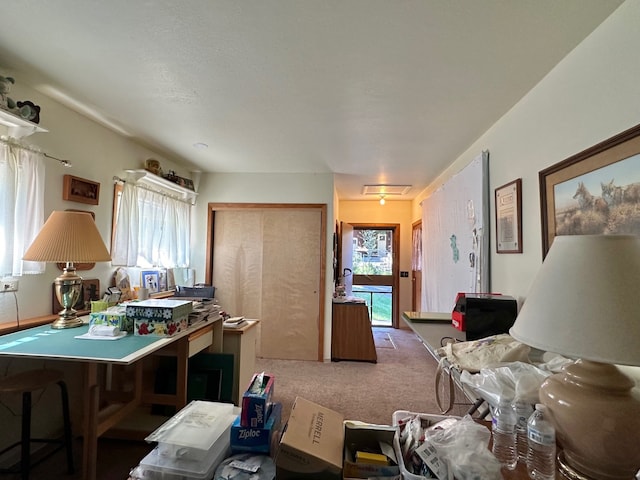 interior space featuring carpet, plenty of natural light, and a kitchen bar