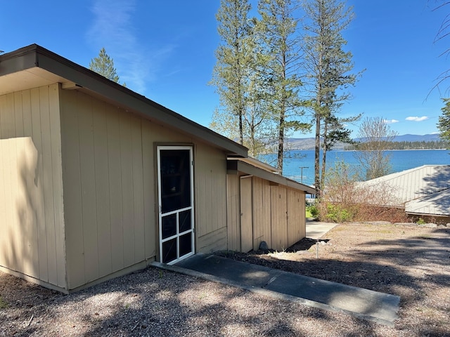 view of side of home featuring a water view