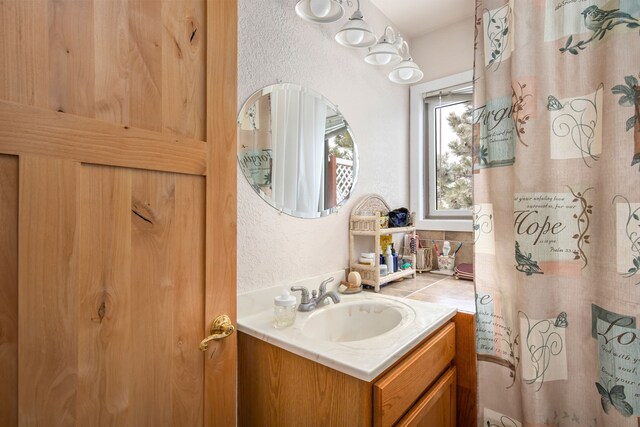 washroom featuring separate washer and dryer, light tile floors, and cabinets