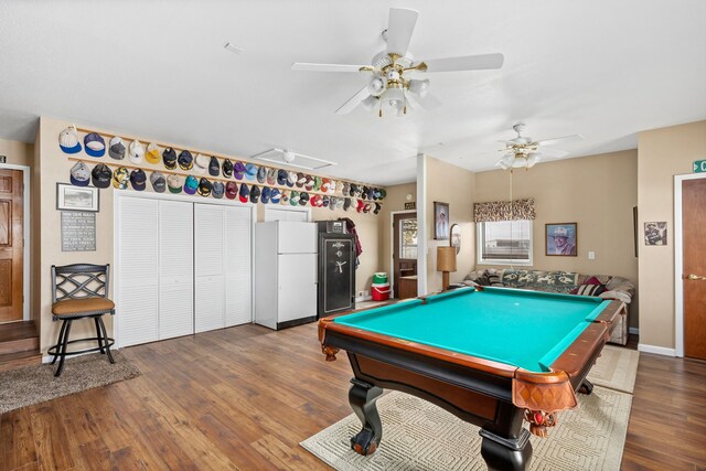 game room with ceiling fan, billiards, and dark hardwood / wood-style flooring