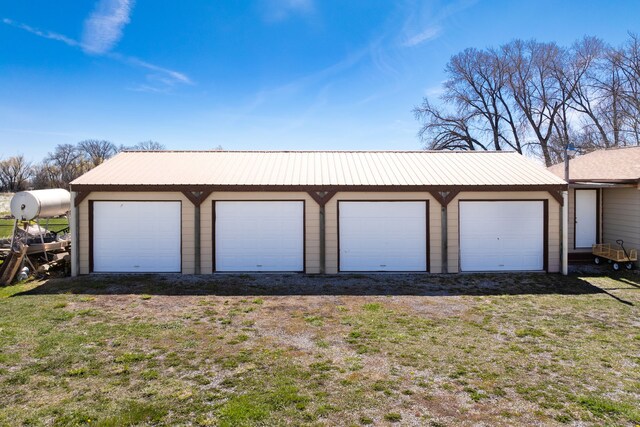 garage with a yard