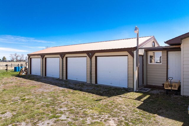 garage with a yard