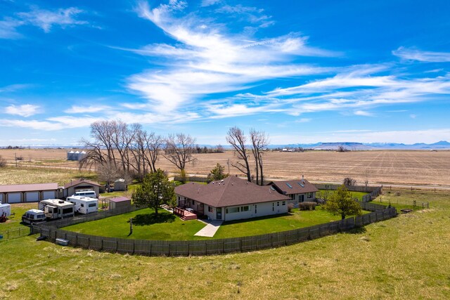 birds eye view of property with a rural view