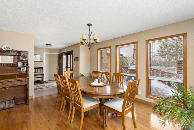 living room with a textured ceiling, ceiling fan, a wood stove, and dark hardwood / wood-style flooring