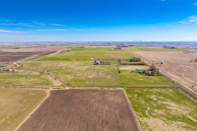 birds eye view of property featuring a rural view