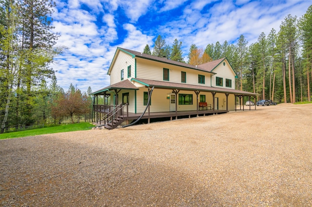 country-style home featuring covered porch