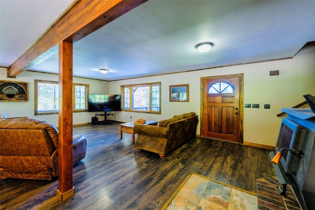 living room with beam ceiling and hardwood / wood-style floors