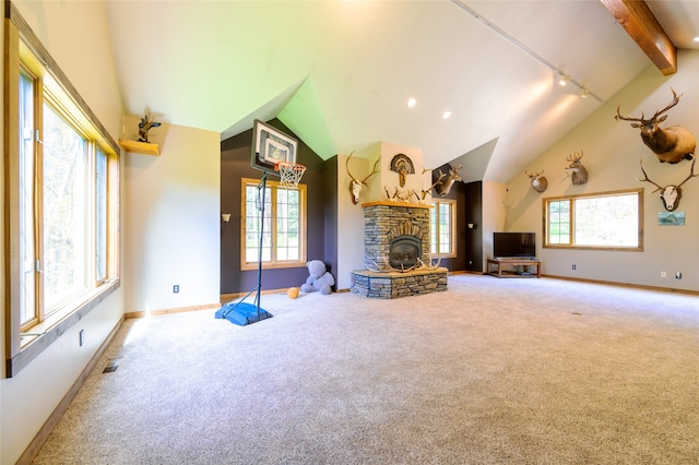 unfurnished living room featuring a fireplace, carpet floors, and vaulted ceiling with beams