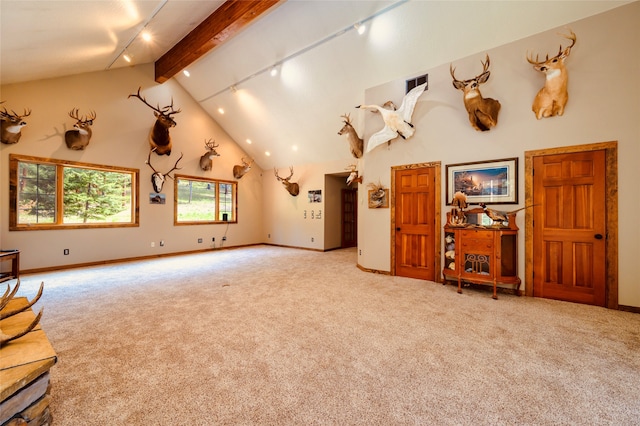 carpeted living room featuring high vaulted ceiling, beam ceiling, and track lighting