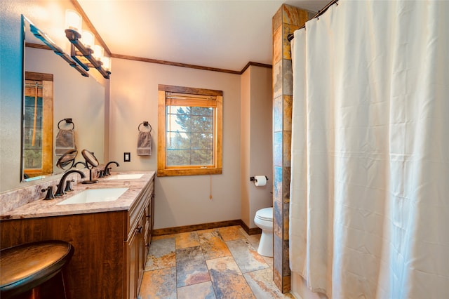 bathroom with tile floors, ornamental molding, toilet, and vanity