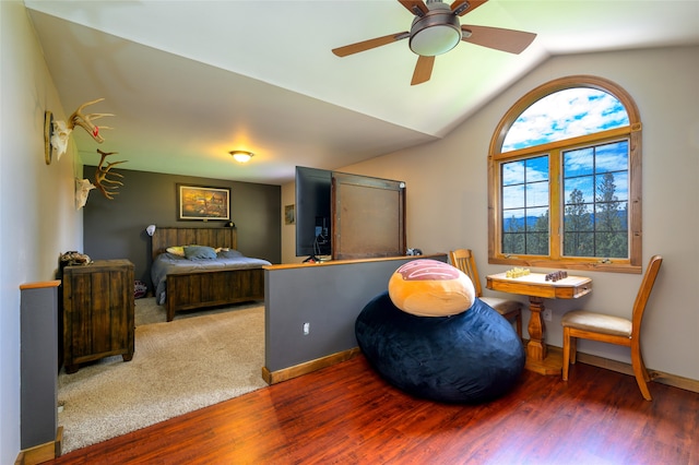 living area with lofted ceiling, carpet floors, and ceiling fan