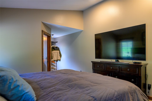 bedroom featuring lofted ceiling