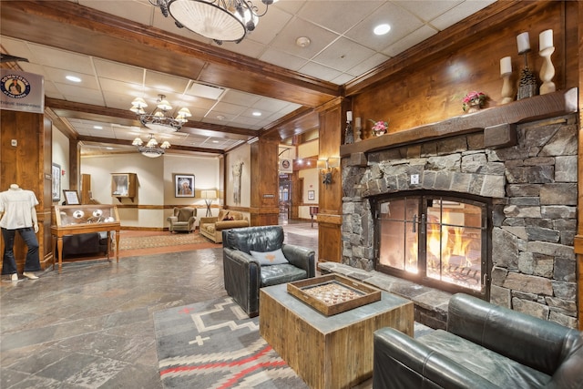 tiled living room with a notable chandelier, a fireplace, and beamed ceiling