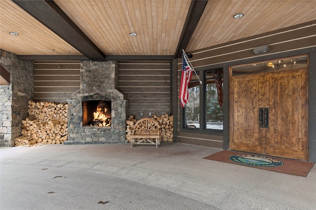 entrance to property with a fireplace and a patio area